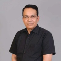 Portrait photo of Dr Asim Negi, middle-aged man with glasses and short hair