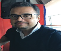Portrait photo of Dr Swapnil Keny, middle-aged man with glasses and mustache