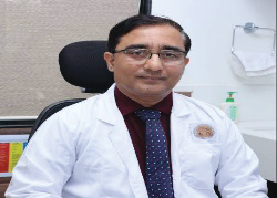 Portrait photo of Dr Ashok Ghodke, middle-aged man with glasses and mustache