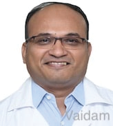 Portrait photo of Dr Sachin Kale, middle-aged man with glasses and mustache