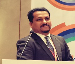 Portrait photo of Dr Hitesh Gopalan, middle-aged man with glasses and mustache