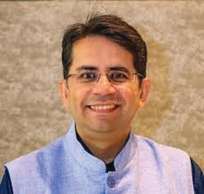 Portrait photo of Dr Neeraj Bijlani, middle-aged man with glasses and mustache