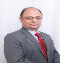 Portrait photo of Dr Sanjay Dhar, middle-aged man with glasses and bald head