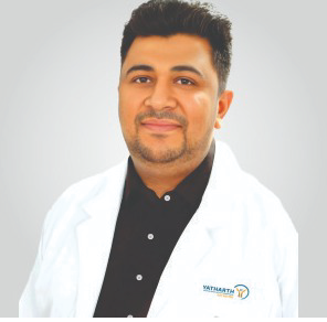 Portrait photo of Dr Saurabh Sharma, middle-aged man with glasses and mustache