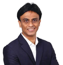 Portrait photo of Dr Ashok Gavaskar, middle-aged man with black hair