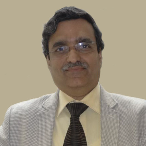 Portrait photo of Dr Rajendra Chandak, middle-aged man with glasses and bald head