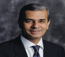 Portrait photo of Dr Sanjay Garude, middle-aged man with glasses and mustache