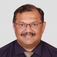Portrait photo of Dr Harshad Argekar, middle-aged man with glasses and mustache